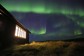 The Northern Lights over the Holkna Studio in Iceland.